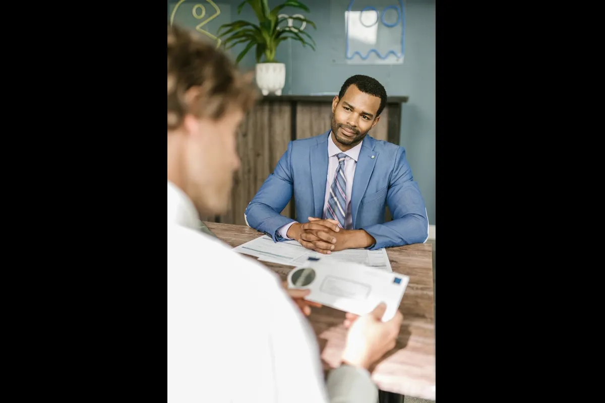 Person filling out a debt review application on a phone — how to apply for debt review in South Africa