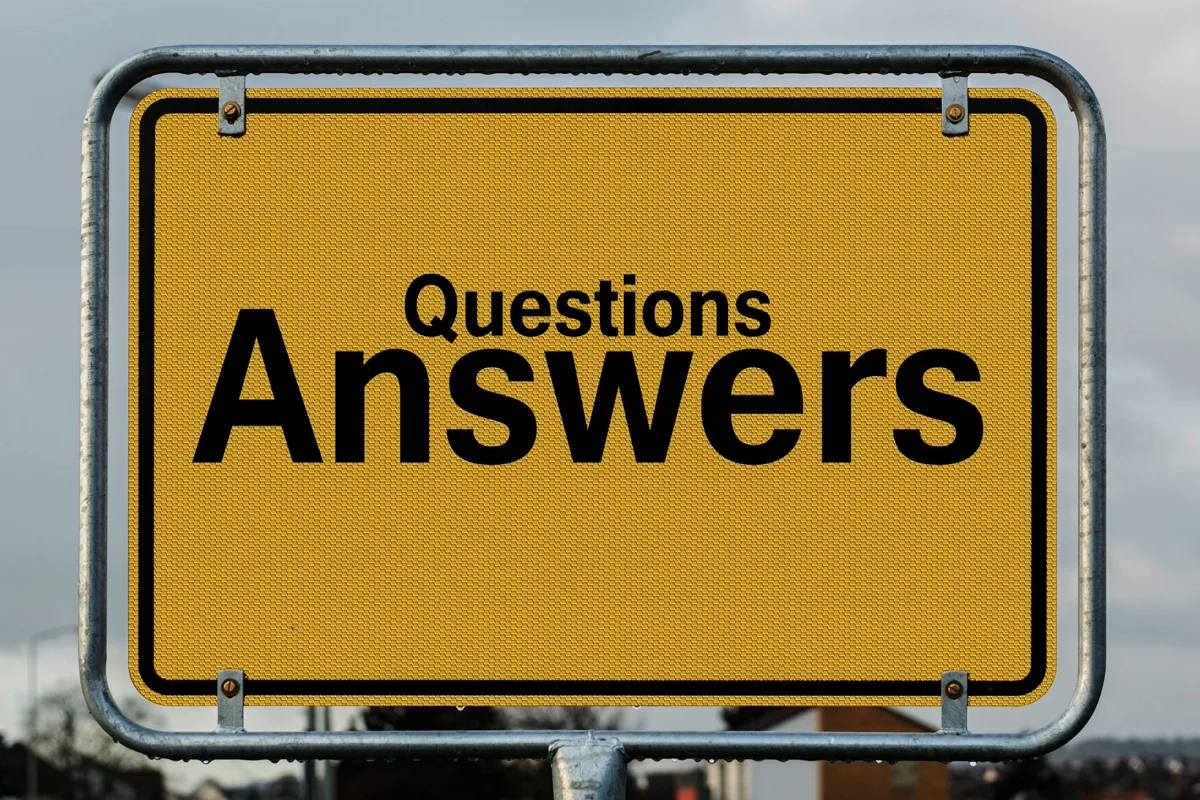 Yellow signpost with questions and answers symbolising sorting fact from fiction about debt review