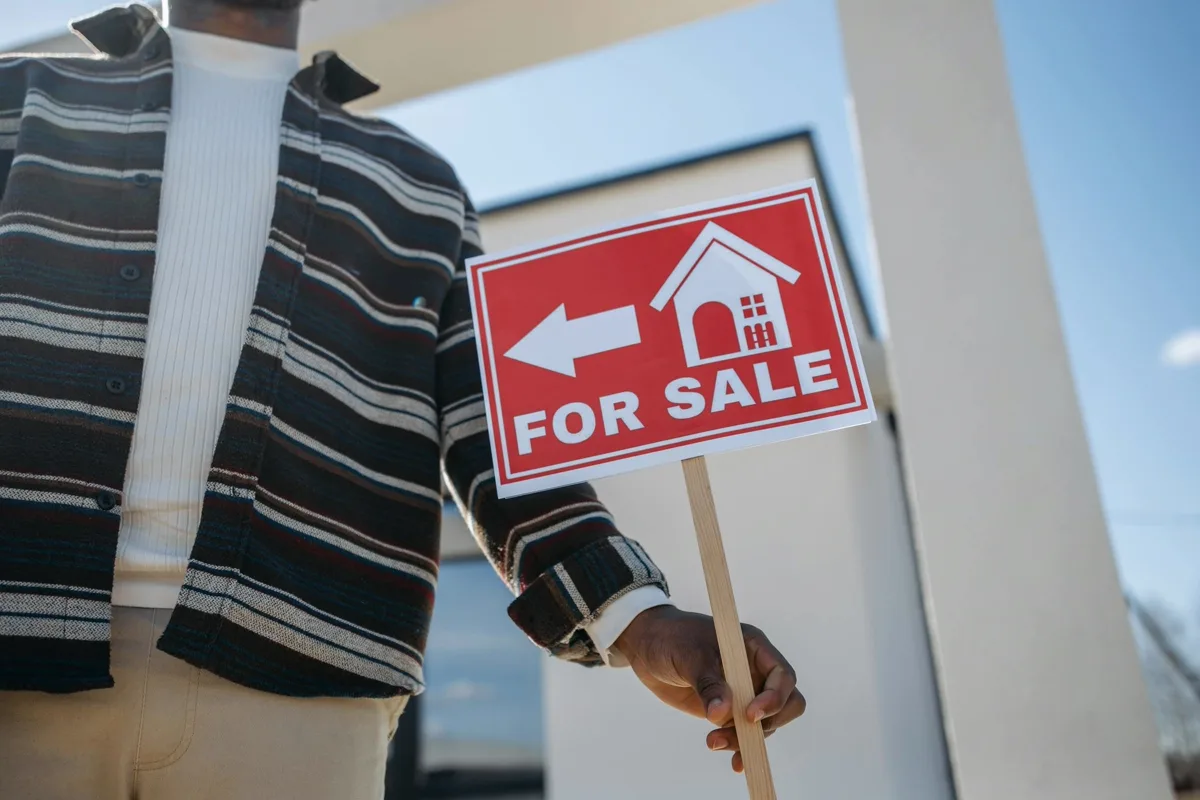 For sale sign outside South African home representing imminent repossession