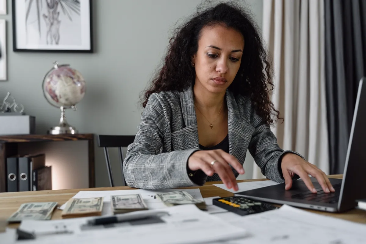 Analyst reviewing South African household debt figures and financial documents